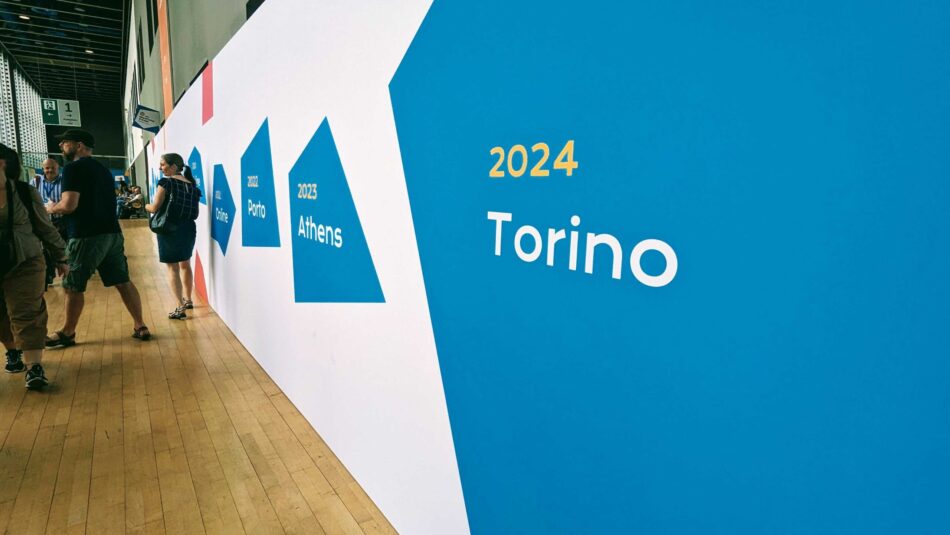 Wall display showing Torino 2024 and the previous WordCamp Europe host cities